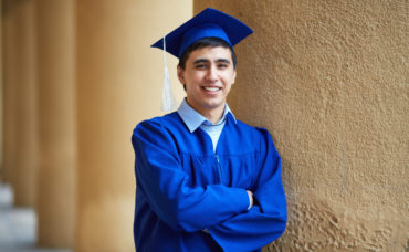 Portrait of confident graduation student looking at camera